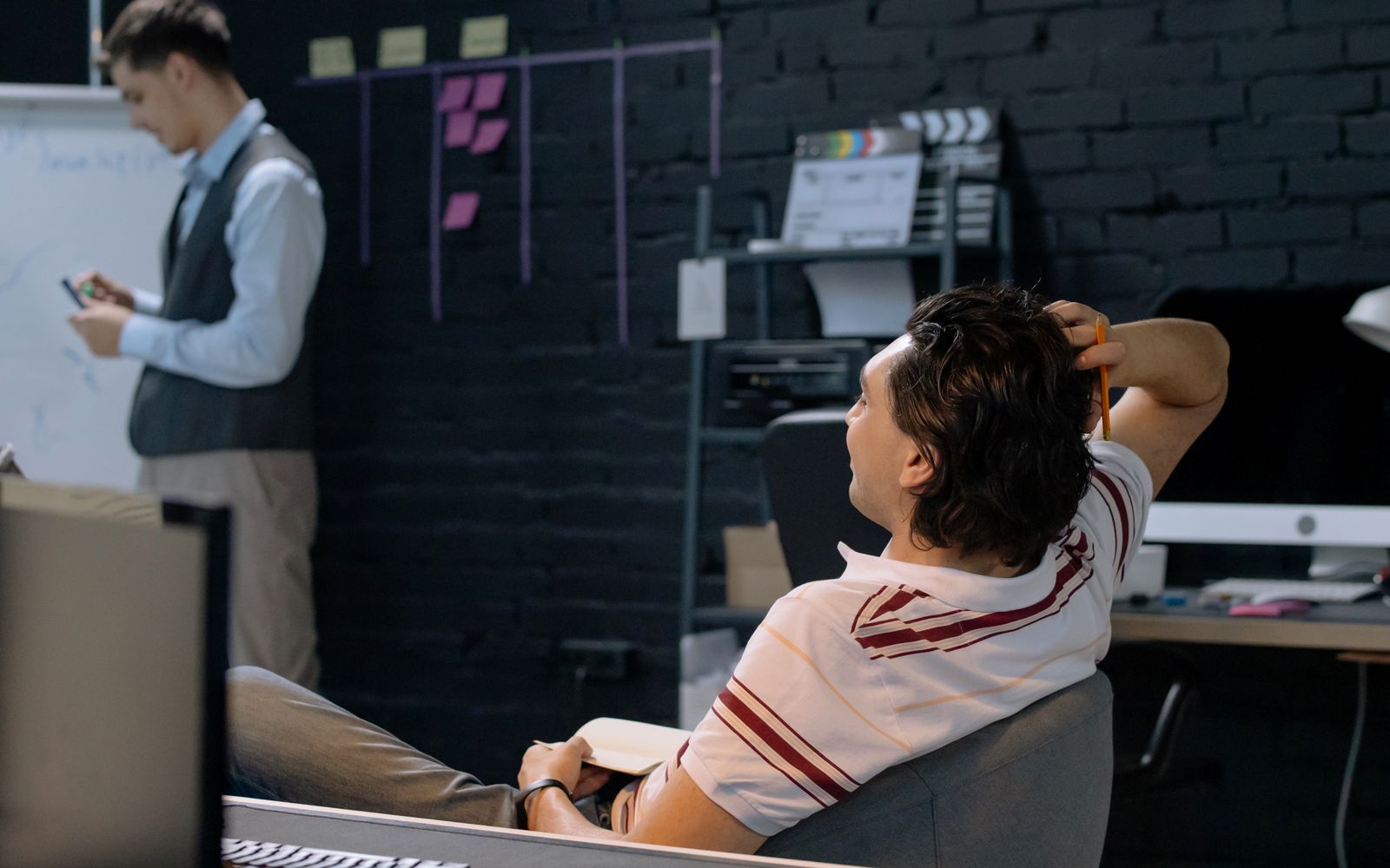 Two colleagues in a casual office meeting